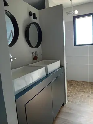 a bathroom with a sink and a mirror on the wall at Villa de charme à Cucuron au pied du luberon in Cucuron