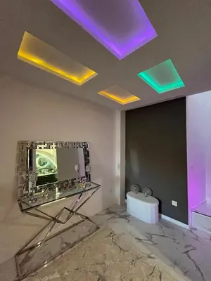 a bathroom with a mirror and lights on the ceiling at Trésor Étoile, luxe & lumière - Duplex 4 personnes in Pertuis