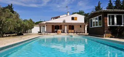a swimming pool in front of a house at Villa en Provence avec piscine in Sénas