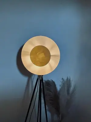a fan on top of a tripod in a room at La Biscornue in Lauris