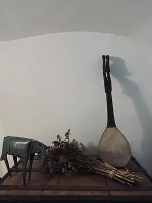 a statue of a spoon and a knife on a table at La Biscornue in Lauris