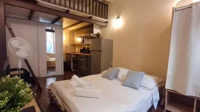 a bedroom with a white bed with towels on it at La cachette d'Aix in Aix-en-Provence
