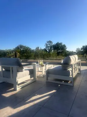 a group of benches sitting on a patio at Villa contemporaine de luxe in Aix-en-Provence