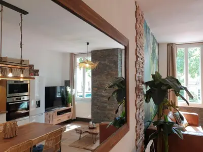a living room with a table and a dining room at Bali Dream I Hyper Centre Fountain Moussue in Salon-de-Provence
