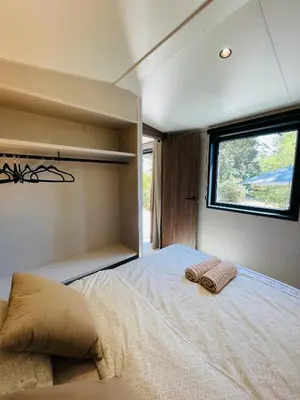 a bedroom with a bed with two pillows on it at Tiny Aix - Maison Odonata in Aix-en-Provence