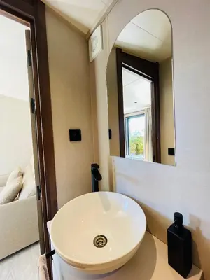 a bathroom with a white sink and a mirror at Tiny Aix - Maison Odonata in Aix-en-Provence