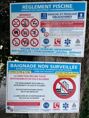 a sign that says no swimming and other prohibited signs at Tiny Aix - Maison Odonata in Aix-en-Provence