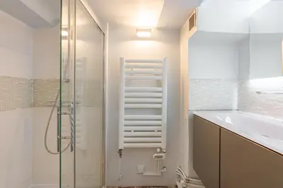 a bathroom with a shower and a sink and a tub at Cardinale 4 rooms in Aix-en-Provence