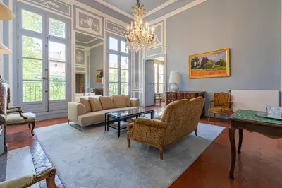 a living room with a couch and a table at Cardinale 4 rooms in Aix-en-Provence