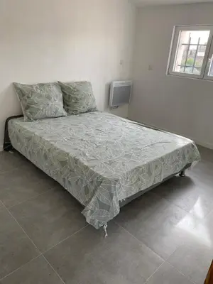 a large bed in a room with at Un jour en Provence in Cabannes