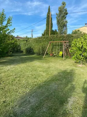 a playground in a yard with a yellow frisbee at Un jour en Provence in Cabannes