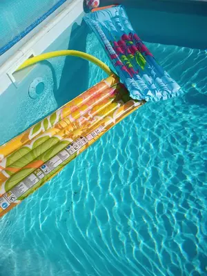 a swimming pool with an oar in the water at Gite Le Petit Luberon LISIANTHUS in Cabrières-dʼAvignon
