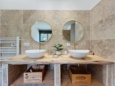 a bathroom with two sinks and two mirrors on a counter at Chambre Deluxe - vue jardin - située dans le triangle d'or du Luberon in Ménerbes