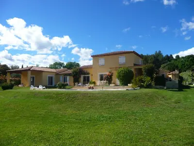 a large house with a lawn in front of it at Maison en Provence in Jouques
