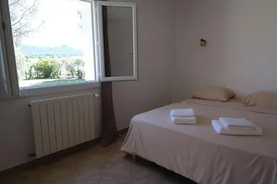 a bedroom with a bed with two towels on it at Villa overlooking the Alpilles Saint Remy de Provence LS1-454 in Saint-Rémy-de-Provence