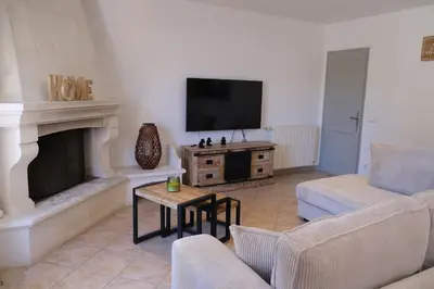 a living room with a fireplace and a tv at Villa overlooking the Alpilles Saint Remy de Provence LS1-454 in Saint-Rémy-de-Provence