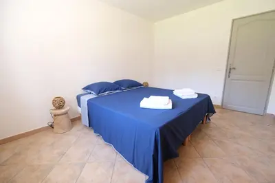 a blue bed with blue sheets and towels on it at Villa overlooking the Alpilles Saint Remy de Provence LS1-454 in Saint-Rémy-de-Provence