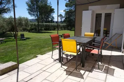 a table and chairs sitting on a patio at Villa overlooking the Alpilles Saint Remy de Provence LS1-454 in Saint-Rémy-de-Provence