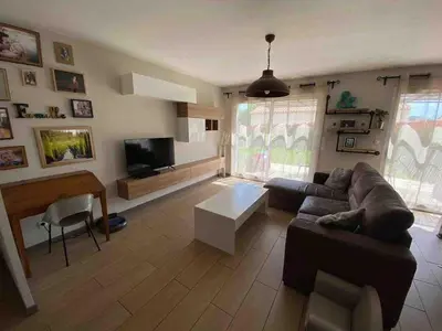 a living room with a couch and a table at Quiet house in provence in Lauris