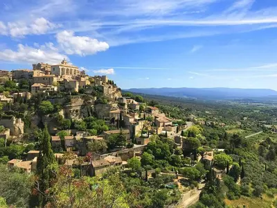 a village on top of a hill with houses at Quiet house in provence in Lauris