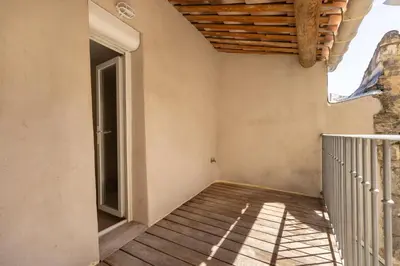 an empty room with a staircase and a window at Le Lavandin - 3 to 4 beds - Hypercentre - Wifi in Apt