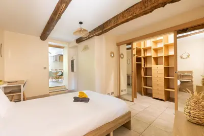 a bedroom with a bed and a desk in a room at Le Lavandin - 3 to 4 beds - Hypercentre - Wifi in Apt