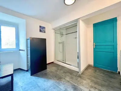 a bathroom with a shower and a glass door at Miraluna - Village médiéval, calme, insolite, 6 personnes in Miramas
