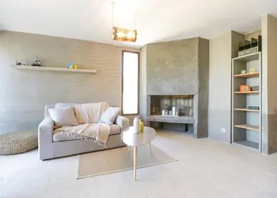 a living room with a couch and a table at La Grande Bergerie in Saint-Saturnin-les-Apt