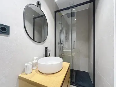 a bathroom with a sink and a mirror at Côté Palmier - Luxurious 2-room - Center-by PauseAixoise in Aix-en-Provence