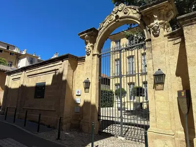 an entrance to a building with an ornate gate at La Suite 4 Dauphins- Aix en Provence in Aix-en-Provence