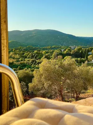 a bedroom with a view of a mountain at Exceptional Bastide in Lourmarin, Luberon in Lourmarin