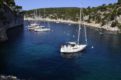 three boats are docked in a body of water at Les Chambres De Charlotte in Cucuron