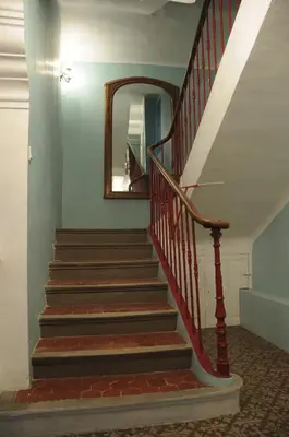 a staircase in a house with a mirror and a mirror at Les Chambres De Charlotte in Cucuron