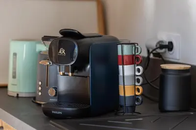 a coffee maker sitting on top of a counter at Dolce Vita Piscine in LʼIsle-sur-la-Sorgue