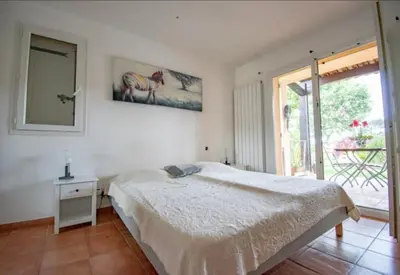 a white bedroom with a bed and a window at Magnifique villa avec piscine à 2 pas du centre d'Aix in Aix-en-Provence