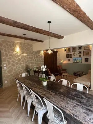 a living room with a large table and chairs at Les Romarins - 5 chambres in Lauris