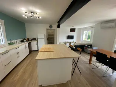 a large kitchen with a table and chairs in it at Maison Aix-en-Provence in Aix-en-Provence