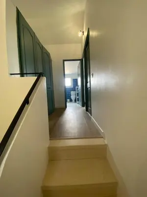 a hallway with stairs leading to a room at Maison Aix-en-Provence in Aix-en-Provence