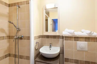 a bathroom with a sink and a shower at Les Coteaux de Pont Royal en Provence - maeva Home - Maison 3 pièces 6 personnes - Sélection MAE-9993 in Mallemort