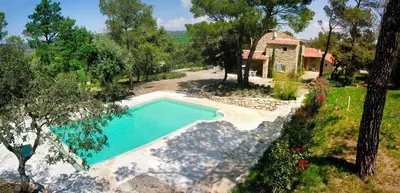 an overhead view of a swimming pool next to a house at Mas provençal - Beautiful Provencal farmhouse, heated pool in Murs