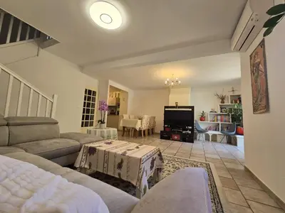a living room with a couch and a tv at 3 Bedroom House Terrace Park & Free Parking in Aix-en-Provence