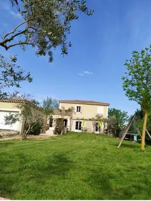 a house with a large yard with a playground at Belle bastide provençale in Noves
