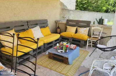 a patio with a couch and a table at Belle bastide provençale in Noves