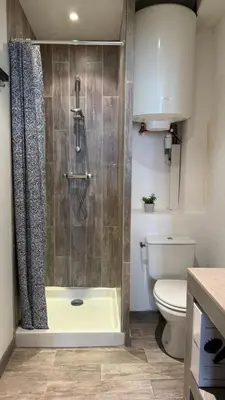 a bathroom with a shower and a toilet at Studio dans le centre ancien in Carpentras