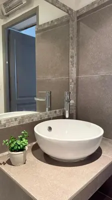 a bathroom with a white sink on a counter at Studio dans le centre ancien in Carpentras