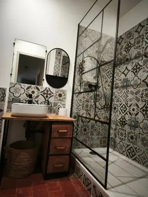 a bathroom with a sink and a mirror at La dominique in Villes-sur-Auzon