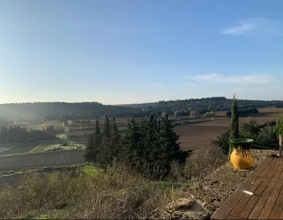 a large yellow vase sitting on top of a hill at Maison de vacances en pleine nature in Aurons