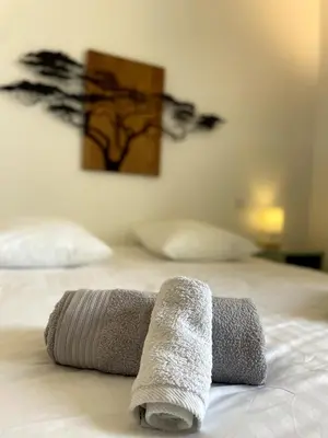 a pair of towels sitting on top of a bed at La tanière d'Agoult in Goult