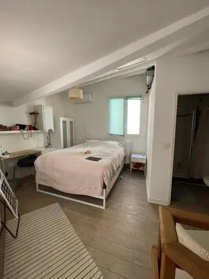 a bedroom with a large bed and a desk at inactive in Aix-en-Provence