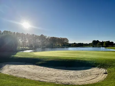 a view of a golf course with a pond at Maison en Provence avec Piscine et Climatisation - FR-1-658-36 in Mallemort